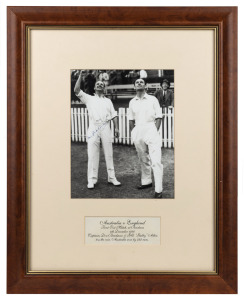 DON BRADMAN & GUBBY ALLEN, opposing captains, signed photograph at Brisbane, 4th December 1936 before the start of the First Test. Australia won by 322 runs. Framed & glazed; overall 51 x 41cm.