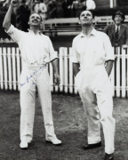 DON BRADMAN & GUBBY ALLEN, opposing captains, signed photograph at Brisbane, 4th December 1936 before the start of the First Test. Australia won by 322 runs. Framed & glazed; overall 51 x 41cm. - 2