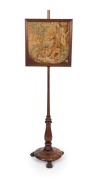 An antique English mahogany pole screen with claw feet, carved platform base, turned column and tapestry top, 19th century. ​​​​​​​Note: Missing finial. 135cm high
