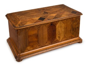 WILLIAM NORRIE antique New Zealand timber box, totara, puriri, mottled kauri, kohekohe, rewarewa, maire and others, late 19th century. Fitted with two lift out trays adorned with original blue velvet lining. Norrie was one of New Zealand's most successful box makers operating out of Shortland Street, Auckland and was awarded a medal for excellence at the Sydney International Exhibition, 1879. 21cm high, 42.5cm wide, 23cm deep
