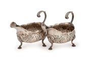 A fine pair of antique English sterling silver sauce boats, made by Robert and David Hennell of London, circa 1765, 10cm high, 13cm wide, 314 grams total