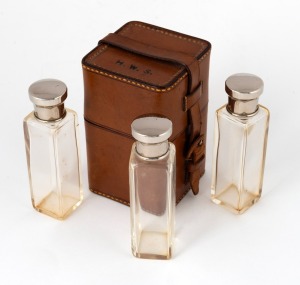 H.W. STEVENSON: 12 x 7 x 7cm leather case embossed 'H.W.S.' on lid, with matching spaces for four liquor containers with metal caps inside, of which three present.