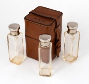 H.W. STEVENSON: 12 x 7 x 7cm leather case embossed 'H.W.S.' on lid, with matching spaces for four liquor containers with metal caps inside, of which three present.