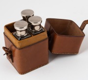 H.W. STEVENSON: 12 x 7 x 7cm leather case embossed 'H.W.S.' on lid, with matching spaces for four liquor containers with metal caps inside, of which three present. - 2