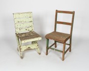 Two rustic green painted timber chairs