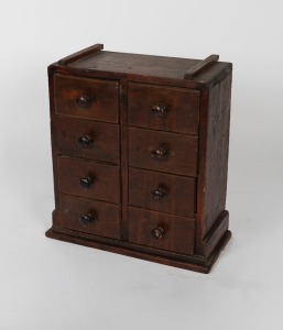A rustic Folk Art eight drawer miniature chest, 19th/20th century, 52cm high, 47cm wide, 23cm deep