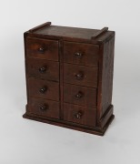 A rustic Folk Art eight drawer miniature chest, 19th/20th century, ​​​​​​​52cm high, 47cm wide, 23cm deep