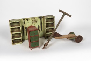 Australian Folk Art painted toy scooter, miniature chest of drawers and tool rack, early to mid 20th century, (3 items), the miniature chest 35cm high