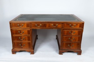 A reproduction twin pedestal desk with insert leather top in the Georgian style, mid 20th century, 77cm high, 152cm wide, 91cm deep