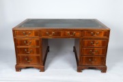 A reproduction twin pedestal desk with insert leather top in the Georgian style, mid 20th century, 77cm high, 152cm wide, 91cm deep