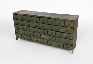 An antique Australian folk art workshop chest of dawers, fashioned from sheet metal with green painted finish, early 20th century, 32cm high, 64cm wide, 17cm deep
