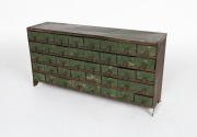 An antique Australian folk art workshop chest of dawers, fashioned from sheet metal with green painted finish, early 20th century, ​​​​​​​32cm high, 64cm wide, 17cm deep