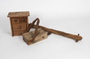 A rustic antique folk art miniature four drawer chest; together with a rustic agricultural yolk and pulley, 19th century, (3 items), the chest 28cm high