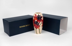 MOORCROFT "Ruby Red" English pottery vase on cream ground, in original box of issue, circa 2012, impressed factory mark and artist details to base, 18.5cm high