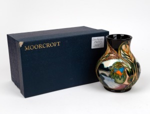 MOORCROFT "Landscape Medley" English baluster shaped pottery vase on black ground, designed Sian Leeper, painted by Karen Walker, in original box of issue, circa 2005, impressed factory mark and artists details to base, 16cm high