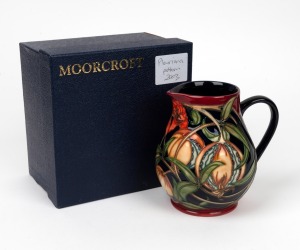 MOORCROFT "Pleuriana" English pottery jug on burgundy and black ground by Rachel Bishop, in original box of issue, circa 2003, impressed factory mark and artist details to base, 14cm high