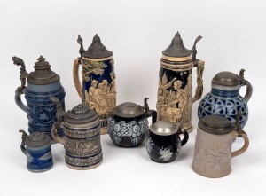 Nine assorted antique and vintage German pottery and porcelain pewter mounted beer steins, including an example with a rare cycling motif to the top, 19th century and 20th century, the largest 31cm high.