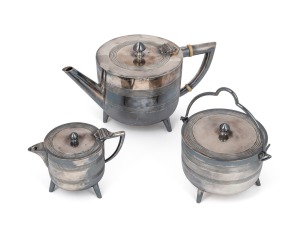 In the manner of CHRISTOPHER DRESSER antique English silver plated three piece tea service, circa 1870, the teapot 11cm high, 20cm wide.
