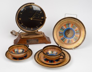 A pair of Japanese porcelain teacup, saucer and plate sets; together with an "ERGOS" vintage electric mantle clock with silver presentation plaque verso "Presented by his workmates to A. E. Speirs on his retirement from the Spotswood V. R. Workshops", (7 items), the clock 24cm high