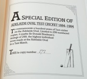"ADELAIDE OVAL TEST CRICKET 1884 - 1984" by Whimpress and Hart, [Adelaide : Wakefield Press, 1984 1st ed.], From a deluxe limited edition of 299, this is #171, issued together with a gilt-embossed leather cricket ball signed by Don Bradman and all still i - 2