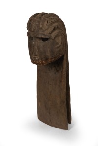 A tribal mask headdress, carved wood with remains of pigment decoration, African origin, 106cm high