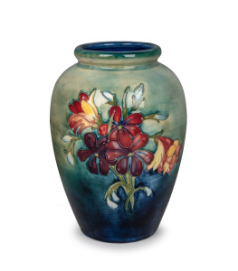 MOORCROFT "Spring Flowers" English pottery vase on blue and celadon green ground, underglaze blue signature mark to base, impressed "Moorcroft, Made in England", 23.5cm high