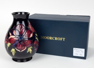 MOORCROFT "Anemone" English baluster shaped pottery vase on dark blue ground, in original box of issue, circa 1990s, impressed factory mark and artist details to base, 19.5cm high