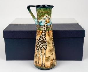MOORCROFT "Giraffe" English pottery jug on green ground by Sian Leeper, limited edition 249/300, in original box of issue, circa 2005, impressed factory mark and artist details to base, 34cm high
