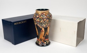 MOORCROFT "Knightswood" English pottery vase on dark ground by Emma Bossons and Nicola Slaney, in original box of issue, circa 1997, impressed factory mark and artists details to base, 26cm high