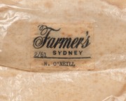 NORMAN O'NEILL'S AUSTRALIAN TEST TEAM 1961 BAGGY GREEN CAP with "Farmers" label in the crown; "2/61" and "N. O'NEILL" typed on the label; green wool, embroidered Australian Coat-of-Arms and the date "1961" to the front panel. (a little dirty or faded). - 7