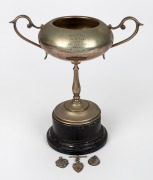 STAWELL GIFT RUNNING RACE: Trophy, likely EPNS, inscribed 'Stawell Jubilee 1927 - 400 Yds Hcp - Won by E.J. Ride (Edwin James Ride)', height 28cm including plinth, plus three small c. 1918 sterling silver race medallions, the three of them 18 grams total.