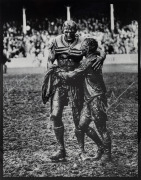 NORM PROVAN and ARTHUR SUMMONS, original signatures on a large format print of the iconic photograph by John O'Gready, known as "The Gladiators"; overall 43 x 34cm.