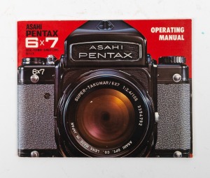 ASAHI KOGAKU: Pentax 6 x 7 SLR camera [#570733] with SMC Takumar 105mm f2.4 lens [#8460313], lens cap, strap, and instruction booklet, c. 1969.