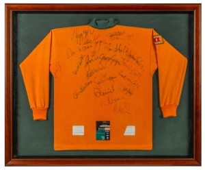 A souvenir Australian rugby team jersey signed by the team, attractively framed and glazed; together with a program from the Australia Vs. Italy second Test, June 25th, 1994, (2 items), ​​​​​​​the larger 87 x 104cm overall