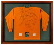 A souvenir Australian rugby team jersey signed by the team, attractively framed and glazed; together with a program from the Australia Vs. Italy second Test, June 25th, 1994, (2 items), ​​​​​​​the larger 87 x 104cm overall