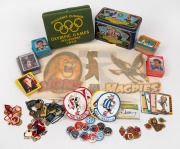 A sporting miscellany in a large plastic tub: includes Melbourne 1956 Olympics Souvenir Cushion; various football club, rugby league, MCC and other types of membership fobs, various collector cards (including Michael Jordan, AFL, cricket, motor racing), v