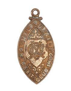 A Melbourne Cricket Club membership fob for 1902-3, made by Gaunt, bronze metal incorporating the MCC cypher; and with the impressed number "2695" verso. Without the distinctive red, white and blue enamel, this may be an error or a prototype.
