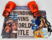 BOXING COLLECTION: Including a large framed Lionel Rose display, a framed photograph of Mike Tyson with Jeff Fenech, a framed poster of a Lester Ellis v Rocky Berg World Championship fight, a pair of Jeff Horn 10oz boxing gloves, and various other signed - 2