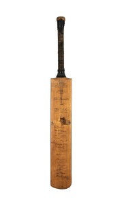 THE AUSTRALIAN TEAM IN ENGLAND 1938: A W.M. Woodfull Australia XI Dominion cricket bat, signed to the front of the blade by the Australian team, including Don Bradman, Stan McCabe, Jack Fingleton, Bill O'Reilly, and Sid Barnes. Additionally signed on the 