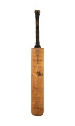 THE AUSTRALIAN TEAM IN ENGLAND 1938: A W.M. Woodfull Australia XI Dominion cricket bat, signed to the front of the blade by the Australian team, including Don Bradman, Stan McCabe, Jack Fingleton, Bill O'Reilly, and Sid Barnes. Additionally signed on the 