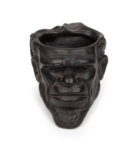1956 MELBOURNE OLYMPICS: Wembley ware Australian Aboriginal ceramic character jug, ​​​​​​​stamped to base "Wembley Ware, Olympics 1956", 10cm, high 17cm wide.