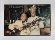A group of mostly signed, mostly mounted and/or framed photographs, removed from a Melbourne restaurant when it was closed in 2003, the signed images include Neil Sedaka, the musician 'Sarita', and Demis Roussos, plus a box of photographs and negatives. ( - 3