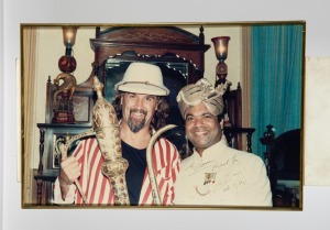 A group of eight framed mostly signed original photographs, removed from a Melbourne restaurant when it was closed in 2003, the signed images include Elton John, Billy Connolly, Sir Cliff Richard, and the Pointer Sisters, the largest 82 x 55cm overall. (8 items)