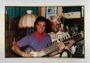 A group of eight framed mostly signed original photographs, removed from a Melbourne restaurant when it was closed in 2003, the signed images include Elton John, Billy Connolly, Sir Cliff Richard, and the Pointer Sisters, the largest 82 x 55cm overall. (8 - 2