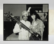 A group of eight framed mostly signed original photographs, removed from a Melbourne restaurant when it was closed in 2003, the signed images include Elton John, Billy Connolly, Sir Cliff Richard, and the Pointer Sisters, the largest 82 x 55cm overall. (8 - 6