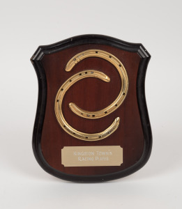 A pair of racing plates mounted on a timber shield with a plaque engraved "KINGSTON TOWN'S RACING PLATES"; overall 28 x 22cm. KINGSTON TOWN (1976 - 1991) was the 1980 Australian Champion Racehorese of the Year.