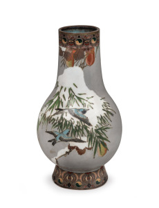 An antique Japanese cloisonne vase with flying birds and snow covered spruce boughs, executed using the Musen shippo technique, Meiji period, 19th/20th century, 23.5cm high.