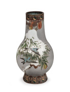 An antique Japanese cloisonne vase with flying birds and snow covered spruce boughs, executed using the Musen shippo technique, Meiji period, 19th/20th century, 23.5cm high.