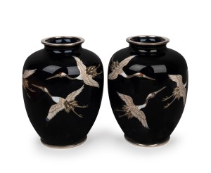 A pair of Japanese cloisonne vases with flying crane decoration on black ground, 20th century, ​​​​​​​12cm high.