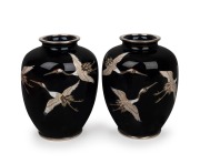 A pair of Japanese cloisonne vases with flying crane decoration on black ground, 20th century, ​​​​​​​12cm high.